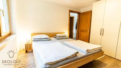 Ein Bett oder Betten in einem Zimmer der Unterkunft Haus Enzian, Blitzingen