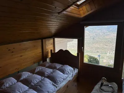 Ein Bett oder Betten in einem Zimmer der Unterkunft Les Trembles MOUNTAIN & QUIET chalet 12 pers
