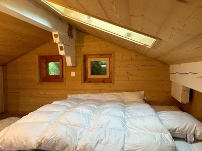 Ein Bett oder Betten in einem Zimmer der Unterkunft Les Trembles MOUNTAIN & QUIET chalet 12 pers