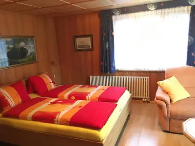 Ein Bett oder Betten in einem Zimmer der Unterkunft Hotel Haus Mühlebach