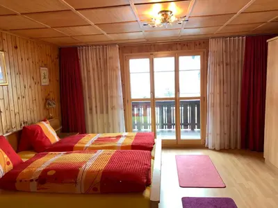 Ein Bett oder Betten in einem Zimmer der Unterkunft Hotel Haus Mühlebach