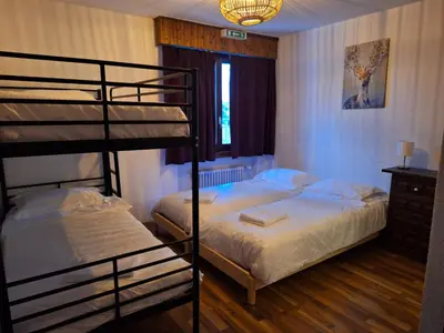 Ein Bett oder Betten in einem Zimmer der Unterkunft Auberge de l'Ours