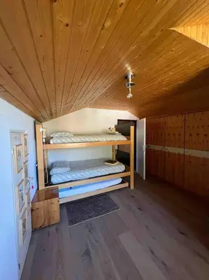 Ein Bett oder Betten in einem Zimmer der Unterkunft Modern Zermatt apartment with Matterhorn view