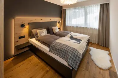 Ein Bett oder Betten in einem Zimmer der Unterkunft Seventh Sky - the luxury one by Inspring Places Zermatt