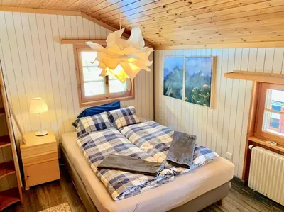 Ein Bett oder Betten in einem Zimmer der Unterkunft Chalet an sonniger aussichtsreicher Lage