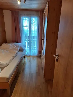 Ein Bett oder Betten in einem Zimmer der Unterkunft Alpengruss