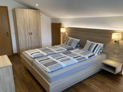Ein Bett oder Betten in einem Zimmer der Unterkunft Apartments Arcadia
