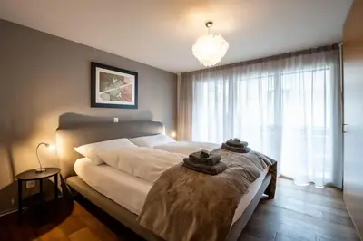 Ein Bett oder Betten in einem Zimmer der Unterkunft Modern & ruhig mit Matterhornblick by ZermattStays