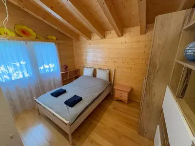 Ein Bett oder Betten in einem Zimmer der Unterkunft Grand chalet au centre
