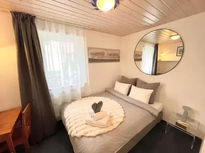 Ein Bett oder Betten in einem Zimmer der Unterkunft Sunny-Nest, Garden Apartment