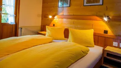 Ein Bett oder Betten in einem Zimmer der Unterkunft Swiss Lodge Joopi