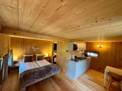 Ein Bett oder Betten in einem Zimmer der Unterkunft Les Mazots du Hameau - Charme Alpin avec Cuisine équipée
