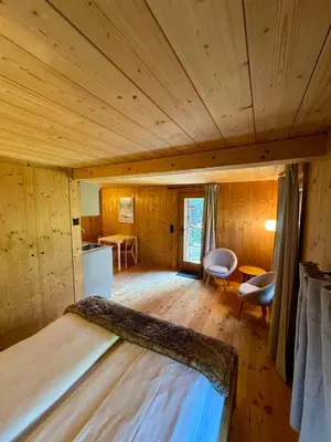 Ein Bett oder Betten in einem Zimmer der Unterkunft Les Mazots du Hameau - Charme Alpin avec Cuisine équipée