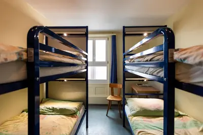 Ein Bett oder Betten in einem Zimmer der Unterkunft Happy Inn Lodge