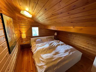 Ein Bett oder Betten in einem Zimmer der Unterkunft Porkka COSY & QUIET chalet 8 pers