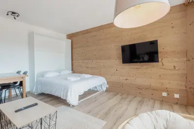 Ein Bett oder Betten in einem Zimmer der Unterkunft Appartement avec vue majestueuse sur les montagnes
