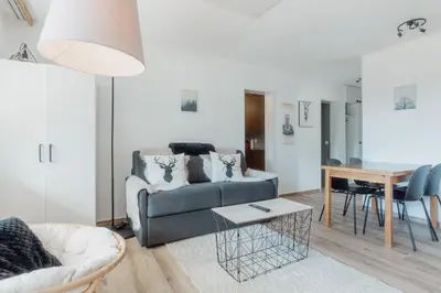 Ein Sitzbereich in der Unterkunft Appartement avec vue majestueuse sur les montagnes