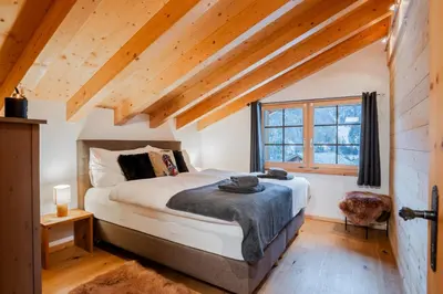 Ein Bett oder Betten in einem Zimmer der Unterkunft Chalet Marmo by HomeFlow