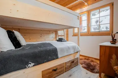 Ein Bett oder Betten in einem Zimmer der Unterkunft Chalet Marmo by HomeFlow