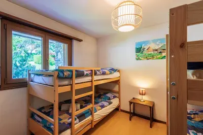 Ein Bett oder Betten in einem Zimmer der Unterkunft Arnica 1 - 6 pers - piscine