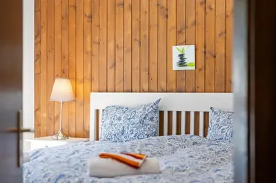 Ein Bett oder Betten in einem Zimmer der Unterkunft Arnica 14 - 6 pers - piscine