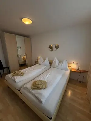 Ein Bett oder Betten in einem Zimmer der Unterkunft Grindelwald Swiss Vacances
