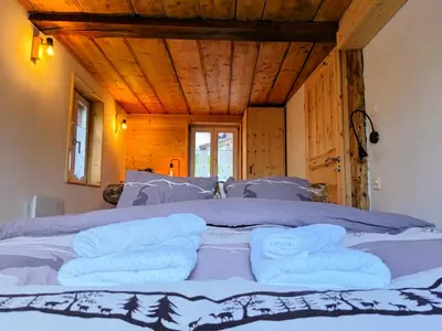 Ein Bett oder Betten in einem Zimmer der Unterkunft Chalet Le Monastère
