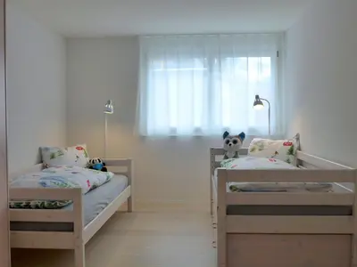 Ein Bett oder Betten in einem Zimmer der Unterkunft Apartment Feldli by Interhome