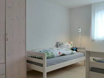 Ein Bett oder Betten in einem Zimmer der Unterkunft Apartment Feldli by Interhome