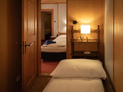 Ein Bett oder Betten in einem Zimmer der Unterkunft Apartment Chalet Turquino - Apartment Marmotte by Interhome