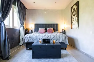 Ein Bett oder Betten in einem Zimmer der Unterkunft Résidence moderne avec jacuzzi