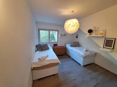 Ein Bett oder Betten in einem Zimmer der Unterkunft Résidence moderne avec jacuzzi