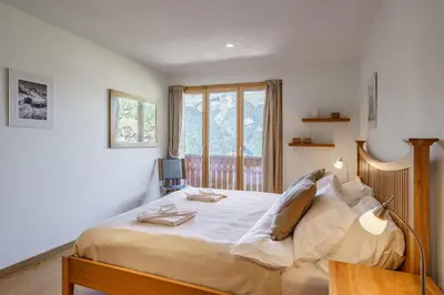 Ein Bett oder Betten in einem Zimmer der Unterkunft Chalet Aquila 5