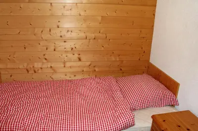 Ein Bett oder Betten in einem Zimmer der Unterkunft Chalet Amos
