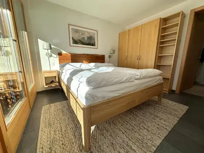 Ein Bett oder Betten in einem Zimmer der Unterkunft Modern self-catering apartment with Matterhorn views