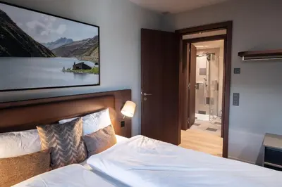 Ein Bett oder Betten in einem Zimmer der Unterkunft Andermatt Alpine Apartments