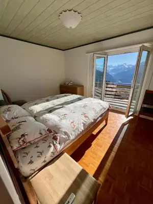 Ein Bett oder Betten in einem Zimmer der Unterkunft Chalet La Louise avec vue imprenable