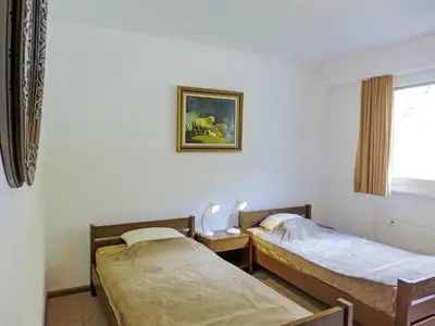 Ein Bett oder Betten in einem Zimmer der Unterkunft Apartment Merises 17 by Interhome