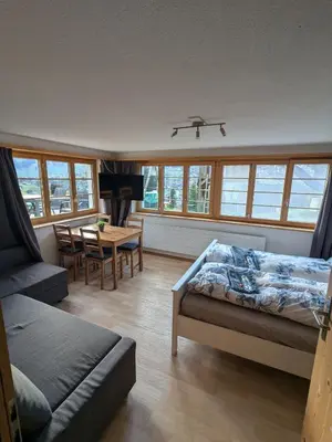 Ein Bett oder Betten in einem Zimmer der Unterkunft Zimmer in Adelboden