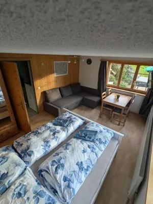 Ein Bett oder Betten in einem Zimmer der Unterkunft Zimmer in Adelboden
