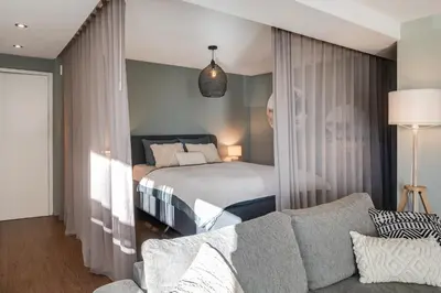 Ein Bett oder Betten in einem Zimmer der Unterkunft Alpen Bijou mit Bergkulisse & Liebe zum Detail