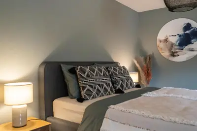 Ein Bett oder Betten in einem Zimmer der Unterkunft Alpen Bijou mit Bergkulisse & Liebe zum Detail
