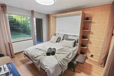 Ein Bett oder Betten in einem Zimmer der Unterkunft Magnifique studio avec terrasse au centre