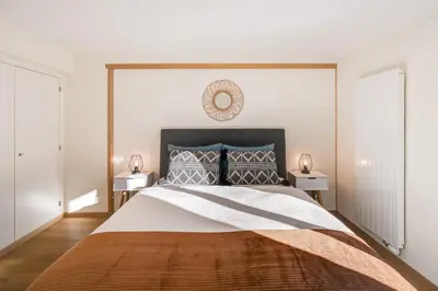 Ein Bett oder Betten in einem Zimmer der Unterkunft Bijou Lohnerblick - sonnig mit Terrasse&Bergsicht