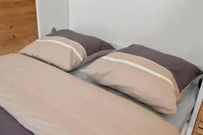 Ein Bett oder Betten in einem Zimmer der Unterkunft Retraite alpine, studio paisible et rénové
