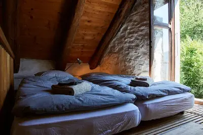 Ein Bett oder Betten in einem Zimmer der Unterkunft Wild Valley Rustico Style in Valle Onsernone