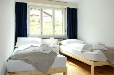 Ein Bett oder Betten in einem Zimmer der Unterkunft Mariposa Spiez