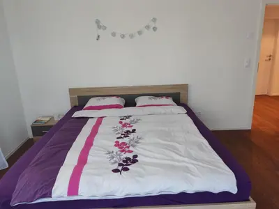 Ein Bett oder Betten in einem Zimmer der Unterkunft Jasmins Airbnb