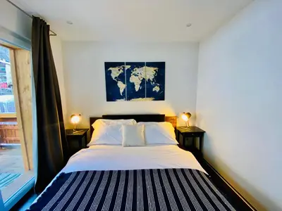 Ein Bett oder Betten in einem Zimmer der Unterkunft Cosy Modern Apartment with balcony and Matterhorn View