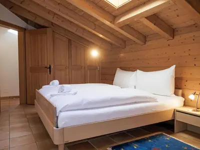 Ein Bett oder Betten in einem Zimmer der Unterkunft Apartment Chalet Pfingstrose by Interhome